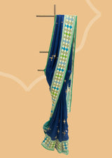 Navy blue phulkari weave booti saree with a striking green phulkari border and pallu. Shop the best collection of authentic, handwoven, pure benarasi sarees with Roliana New Delhi