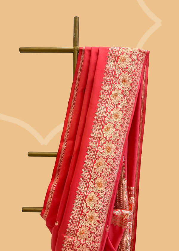 A rose pink soft silk saree with soft meenakari bootas and pallu and border in ornamental weave. A pure Banarasi Sari Shop the best collection of authentic, handwoven, pure benarasi sarees with Roliana New Delhi