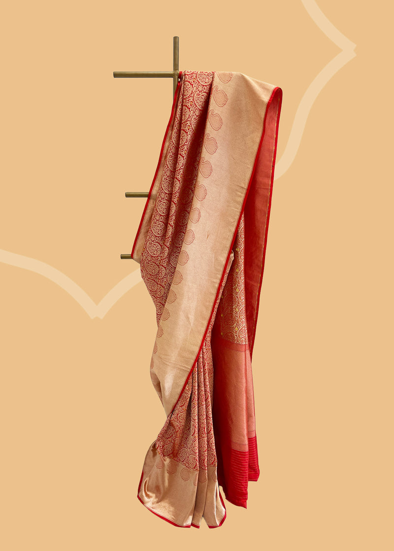 A delightfully rich silk saree with brocade jaal and a thos zari border with paisley inlay weave in gold zari. Shop the best collection of authentic, handwoven, pure benarasi sarees with Roliana New Delhi