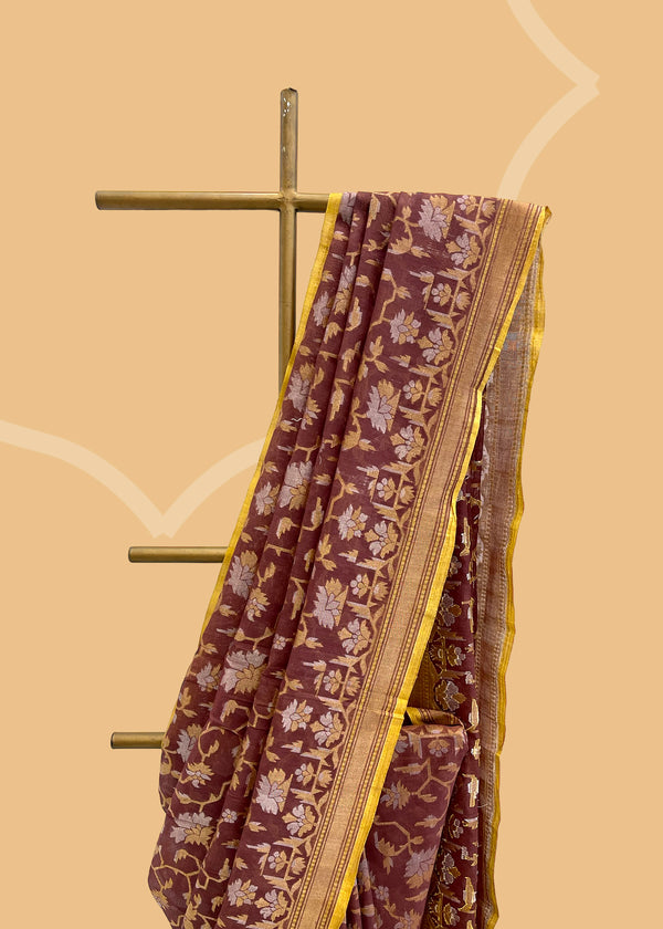 A brick red katha colour jamdani woven muslin saree with gold and silver zari and a contrast lime green kanni. . A pure Banarasi wedding Sari Shop the best collection of authentic, handwoven, pure benarasi sarees with Roliana New Delhi