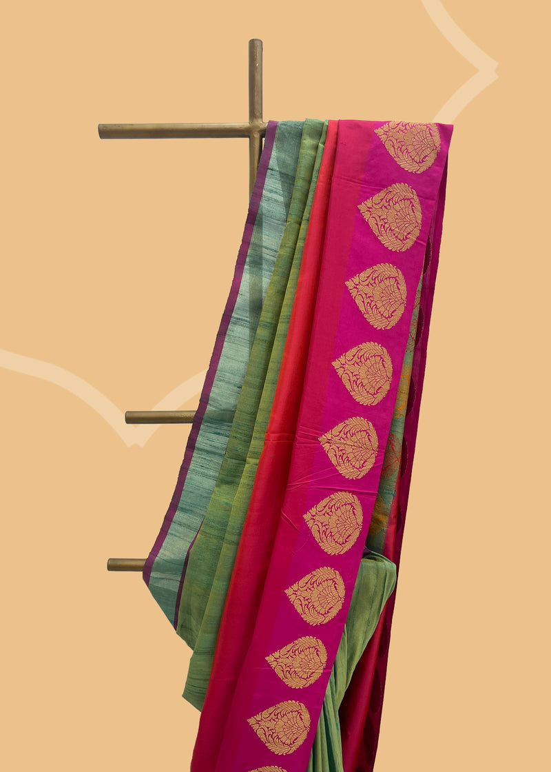 Mehndi green tussar silk saree with a rangkat border of burnt orange and red and zari kadhwa bootis all over the border and pallu. Shop the best collection of authentic, handwoven, pure benarasi sarees with Roliana New Delhi