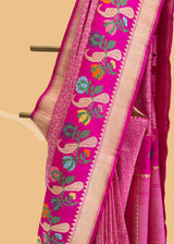 Pink Kanjeevaram style benaresi brocade saree with a beautiful meenakari border of peacocks and multi coloured flowers. Shop the best collection of authentic, handwoven, pure benarasi sarees with Roliana New Delhi
