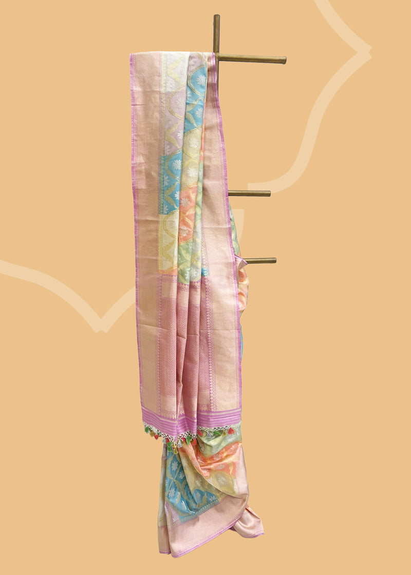 Pure zari rangkat kangoora jaal in silk and tissue weave made in pastel shades of silver peach pista lilac and firozi. A true masterpiece Shop the best collection of authentic, handwoven, pure benarasi sarees with Roliana New Delhi