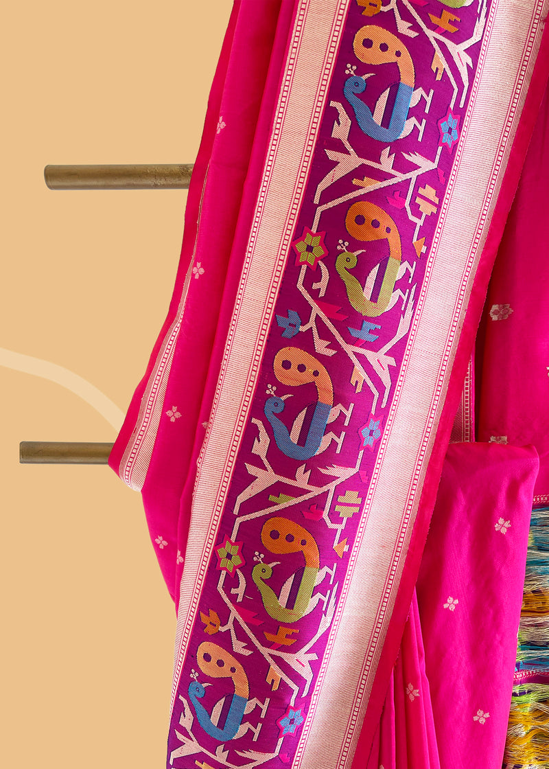 A silk Rani pink saree with bldelicate dot clusters all over and a beautiful paithani inspired woven border and pallu Shop the best collection of authentic, handwoven, pure benarasi sarees with Roliana New Delhi