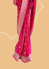 A Rani pink soft silk traditional saree in ektaara silk with kadhwa meenakari bootas and badla border with aarhi stripes Shop the best collection of authentic, handwoven, pure benarasi sarees with Roliana New Delhi
