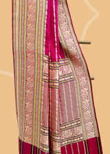 A striking pink satin saree with woven horizontal stripes and a stunning Kanjeevaram inspired border with zari brocade detailing and peacocks Shop the best collection of authentic, handwoven, pure benarasi sarees with Roliana New Delhi