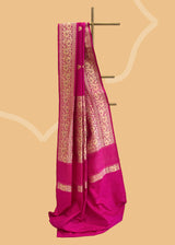 A pink silk saree with woven floral bootas an ornamental floral border and pallu.. A pure Banarasi Sari Shop the best collection of authentic, handwoven, pure benarasi sarees with Roliana New Delhi