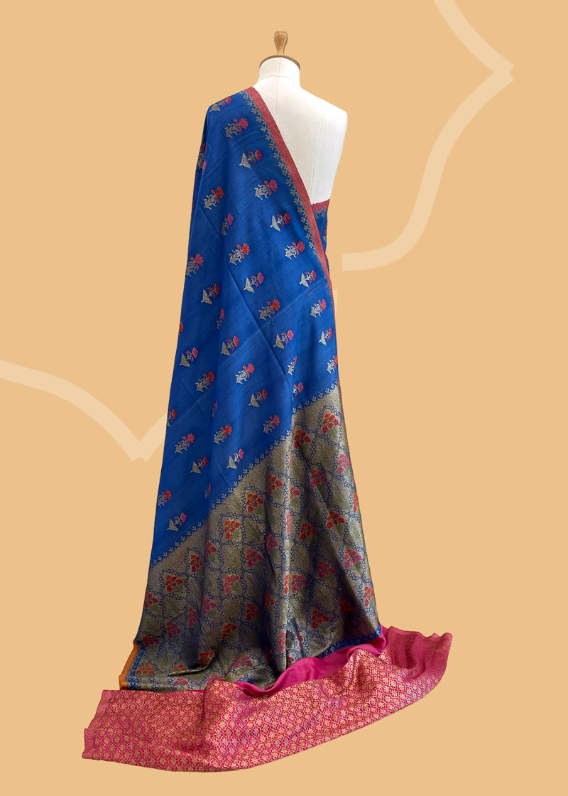 A royal blue tussar Georgette Neel saree with woven meenakari weave. A pure Banarasi Sari Shop the best collection of authentic, handwoven, pure benarasi sarees with Roliana New Delhi