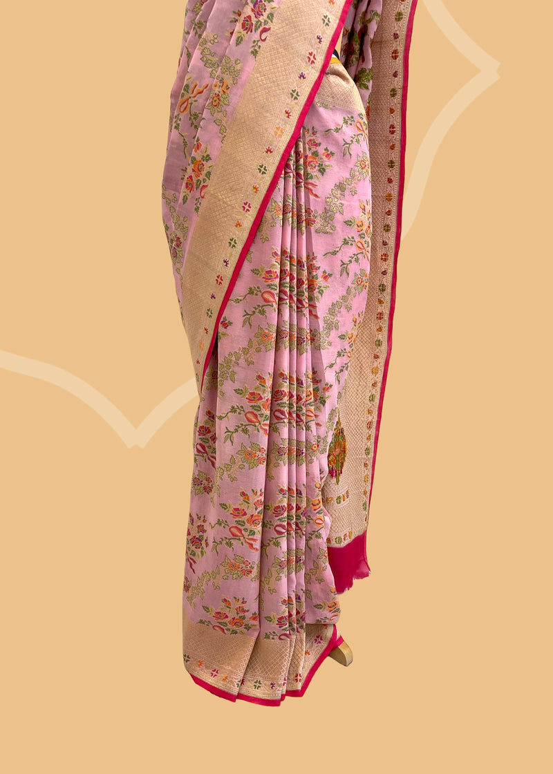 A Georgette woven saree in French flower bouquets and ribbon design all over and a delicate floral border. A pure Banarasi wedding Sari Shop the best collection of authentic, handwoven, pure benarasi sarees with Roliana New Delhi