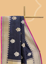 A midnight blue silk tanchoi saree with gold silver woven bootis and border and a beautiful contrast jamuni kanni Shop the best collection of authentic, handwoven, pure benarasi sarees with Roliana New Delhi