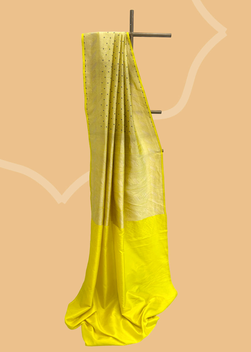 A lime yellow brocade woven saree in a very delicate design with beautiful contrast blue purple detalling.. A pure Banarasi wedding Sari Shop the best collection of authentic, handwoven, pure benarasi sarees with Roliana New Delhi