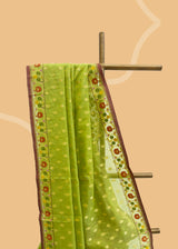A lime green muslin jamdani saree with meenakari dhakai border and a jamuni kanni. Shop the best collection of authentic, handwoven, pure benarasi sarees with Roliana New Delhi