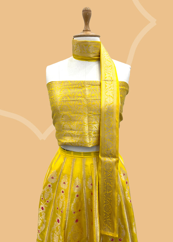 Yellow pure silk banarasi lehenga with meenakari by Roliana Weaves. Shop the best of Pure Benarasi sarees and lehengas at Roliana New Delhi. 