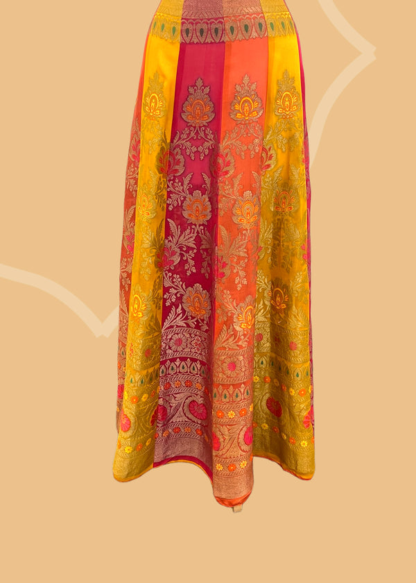Benarasi georgette yellow red lehenga with hand painted flowers by Roliana Weaves. Shop the best of Pure Benarasi sarees and lehengas at Roliana New Delhi. 